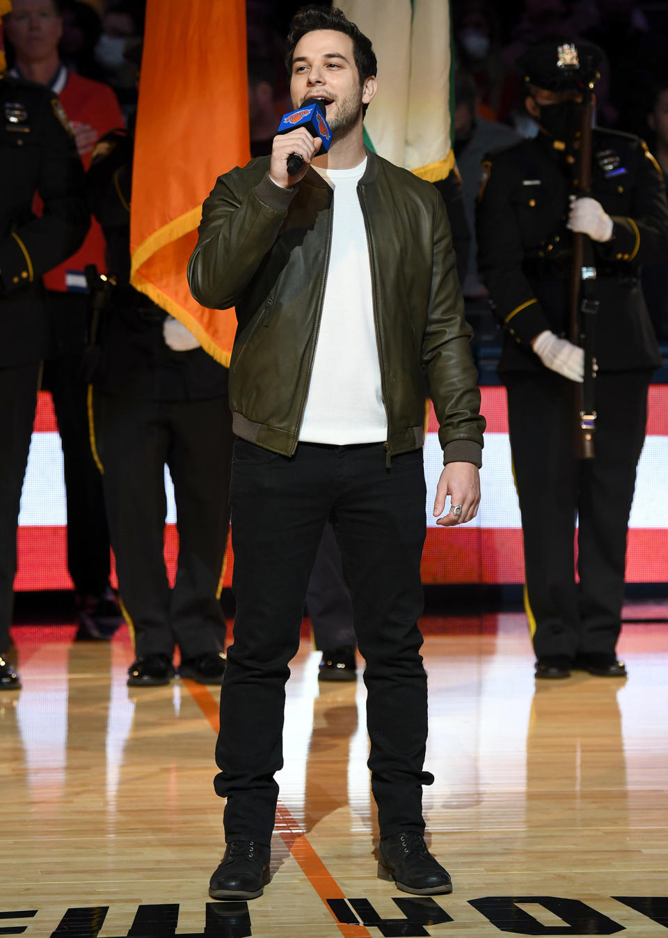 <p>Skylar Astin sings the national anthem to kick off the New York Knicks vs. Atlanta Hawks game at N.Y.C.'s Madison Square Garden on Christmas.</p>