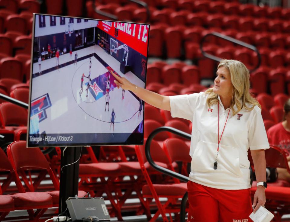 Texas Tech women's basketball coach Krista Gerlich looks at a rendering on a TV screen on the first day of practice, Monday, Sept. 26, 2022, at United Supermarkets Arena in Lubbock.