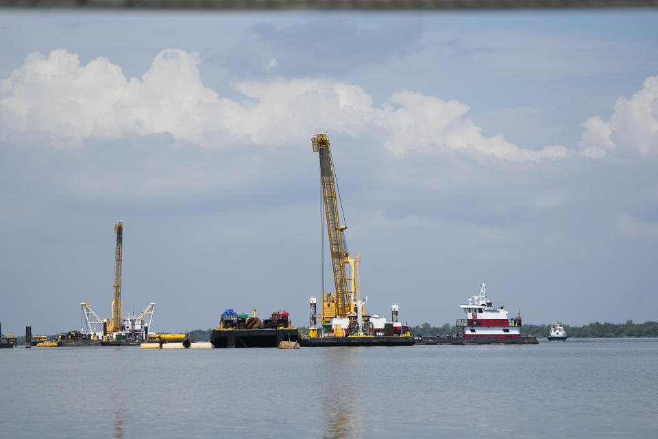 Work in the Mississippi River is seen where sills are being made to help limit salt water intrusion that is progressing upriver due to the unusually low water level in the river in Plaquemines Parish, La., Monday, Sept. 25, 2023. (AP Photo/Gerald Herbert)