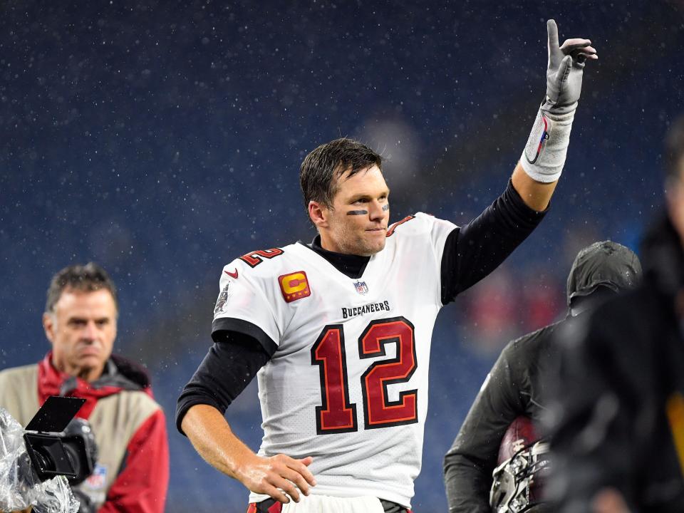 Tampa Bay Buccaneers quarterback Tom Brady reacts as he runs off of the field after a game against the New England Patriots at Gillette Stadium in Foxboro on Oct. 3, 2021.