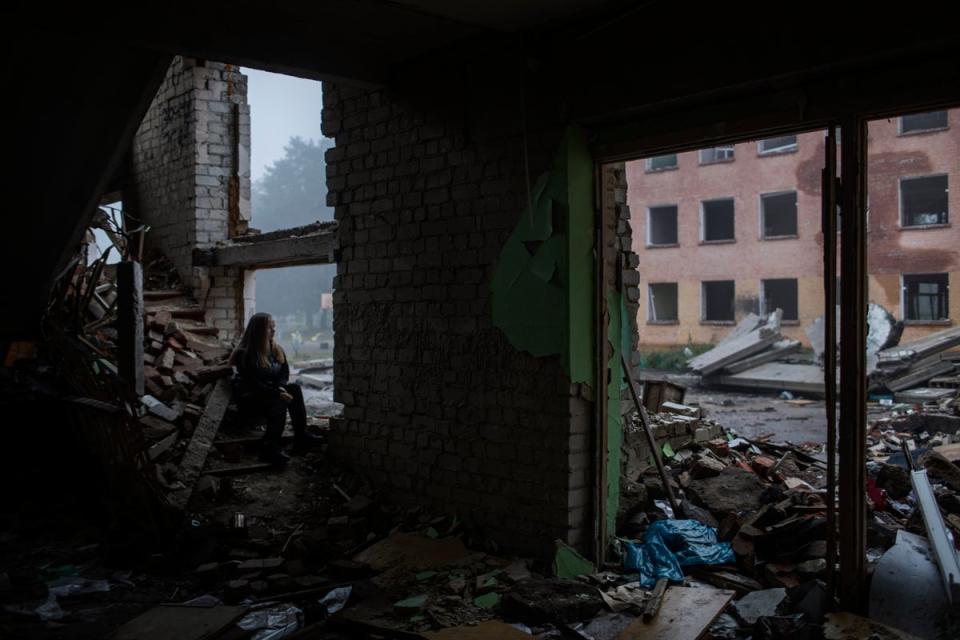 Viktoria Rudenko 14, sits inside her destroyed school (Diego Ibarra Sánchez/Unicef)