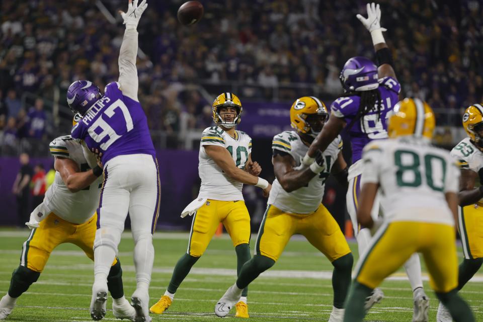 Green Bay Packers' Jordan Love throws a pass during the first half of an NFL football game against the Minnesota Vikings Sunday, Dec. 31, 2023, in Minneapolis. (AP Photo/Bruce Kluckhohn)