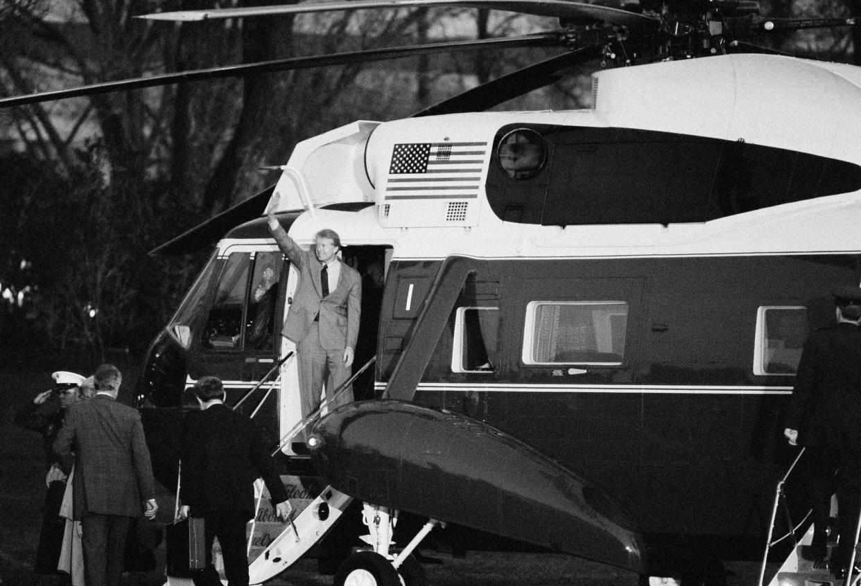 President Carter waves from the Presidential helicopter as he prepares to depart the South Lawn of the White House on March 7, 1979, in Washington D.C., for Andrews Air Force Base and then on to Egypt and Israel for meetings with President Sadat and Prime Minister Begin.