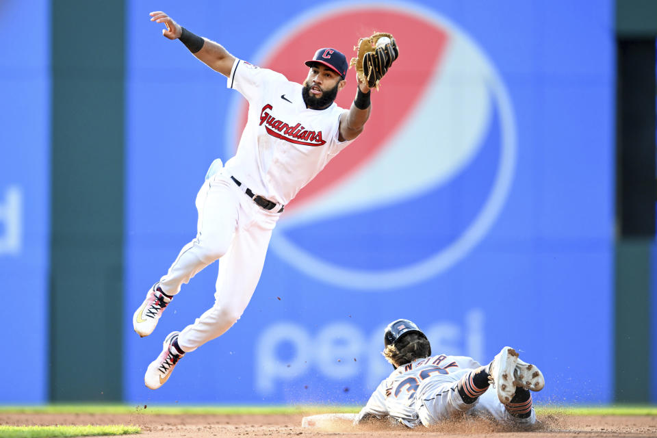 Cleveland Guardians' Amed Rosario covers as Detroit Tigers' Zach McKinstry steals second base during the fifth inning of a baseball game, Tuesday, May 9, 2023, in Cleveland. (AP Photo/Nick Cammett)