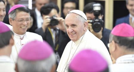 Pope Francis arrives for a meeting with the bishops at the headquarters of the Korean Bishops's Conference in Seoul August 14, 2014. REUTERS/Korea Pool/Yonhap