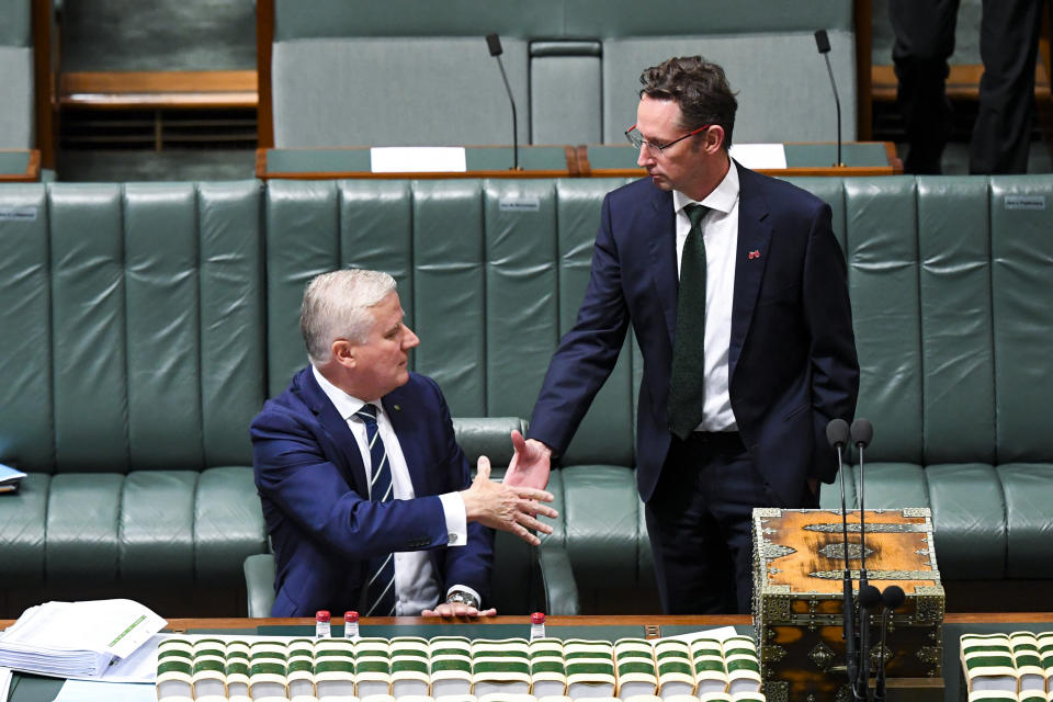 The then outgoing Australian Deputy Prime Minister Michael McCormack (left) shakes hands with Labor MP Stephen Jones. Source: AAP