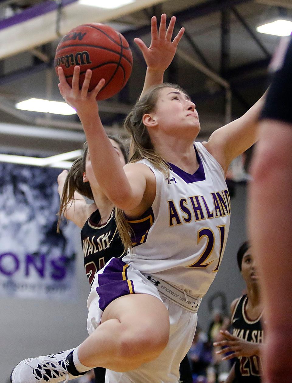 Ashland University's Macy Spielman (21) drives in for a shot against Walsh University during first half college women's basketball action in the Great Midwest Athletic Conference tournament championship game on Saturday, March 5, 2022 at Kates Gymnasium. TOM E. PUSKAR/TIMES-GAZETTE.COM