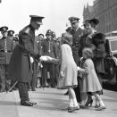 <p>Elizabeth sakes hands as she arrives at the Royal Tournament (PA Archive) </p>