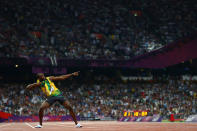 LONDON, ENGLAND - AUGUST 09: Usain Bolt of Jamaica celebrates after winning gold in the Men's 200m Final on Day 13 of the London 2012 Olympic Games at Olympic Stadium on August 9, 2012 in London, England. (Photo by Michael Steele/Getty Images)