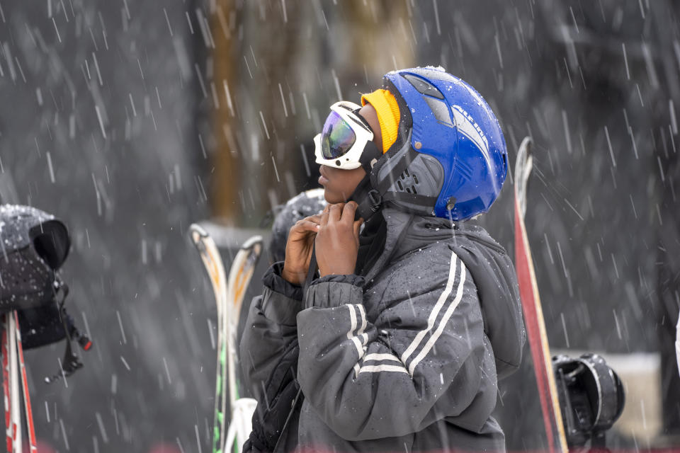 A young skier adjusts his helmet at the Afriski ski resort near Butha-Buthe, Lesotho, Saturday July 30, 2022. While millions across Europe sweat through a summer of record-breaking heat, Afriski in the Maluti Mountains is Africa's only operating ski resort south of the equator. It draws people from neighboring South Africa and further afield by offering a unique experience to go skiing in southern Africa. (AP Photo/Jerome Delay)