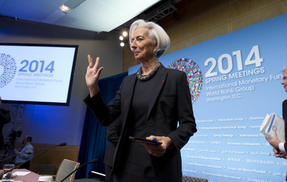 International Monetary Fund (IMF) Managing Director Christine Lagarde waves to the media after a news conference during the IMF/World Bank Spring Meetings at IMF headquarters in Washington, Thursday, April 10, 2014. ( AP Photo/Jose Luis Magana)