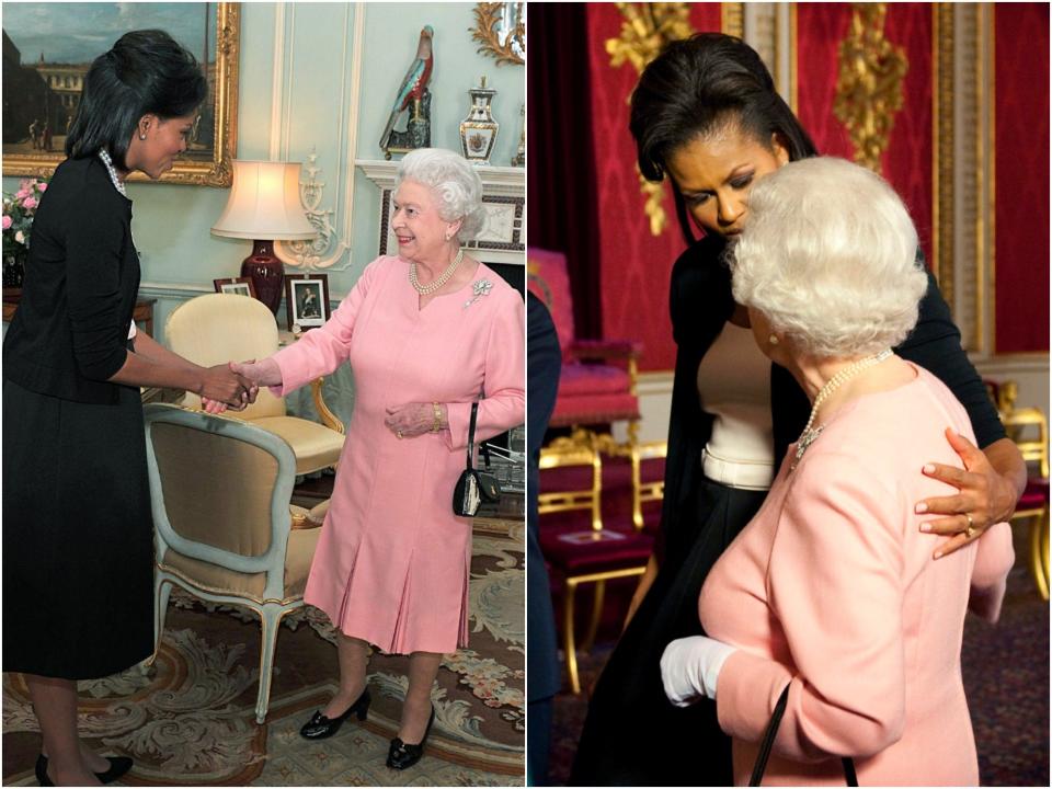 Michelle Obama puts her arm around Queen Elizabeth.