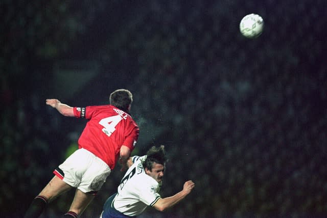 Steve Bruce heads the ball clear during his playing career