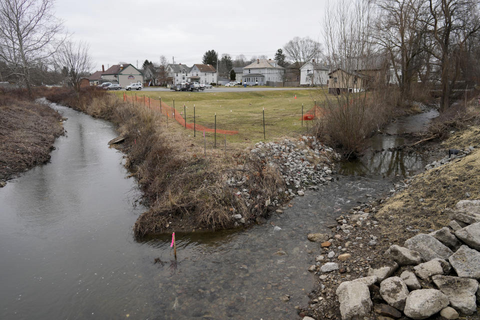 FILE - Sulphur Run, right, flows into Leslie Run in East Palestine, Ohio, on Tuesday, Jan. 30, 2024. Daily life largely returned to normal for residents of East Palestine, Ohio, months after a Norfolk Southern train derailed and spilled a cocktail of hazardous chemicals that caught fire a year ago. (AP Photo/Carolyn Kaster, File)