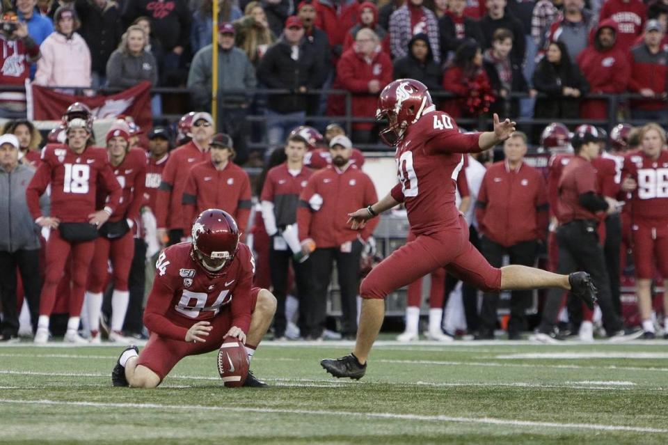 Former Washington State kicker Blake Mazza (40) kicks a field goal that is held by punter Oscar Draguicevich III (94) during the second half of an NCAA college football game against Stanford in Pullman, Wash., Saturday, Nov. 16, 2019. (AP Photo/Young Kwak)