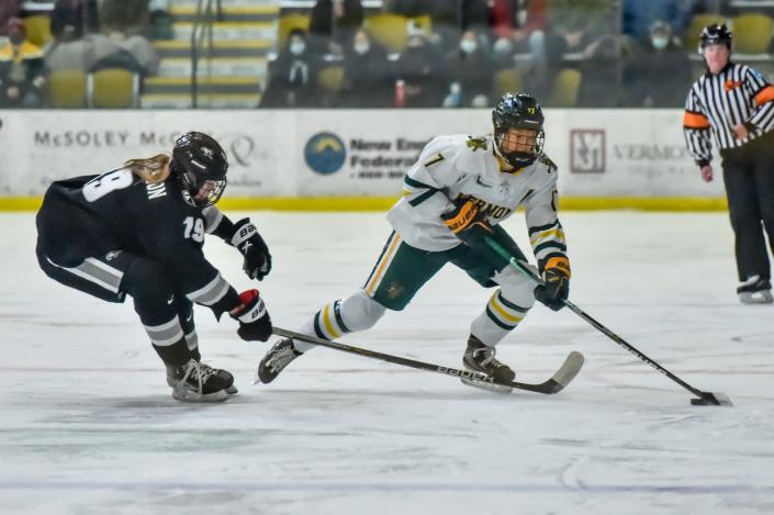 UVM&#39;s Theresa Schafzahl maneuvers past Providence College&#39;s Sara Hjalmarsson during the Catamounts&#39; Hockey East quarterfinal game vs the  Friars on Saturday afternoon at Gutterson Fieldhouse.