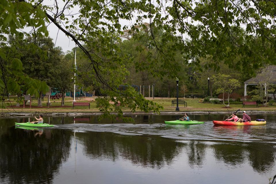 People kayak near Milton Memorial Park Wednesday, May 4, 2022. 