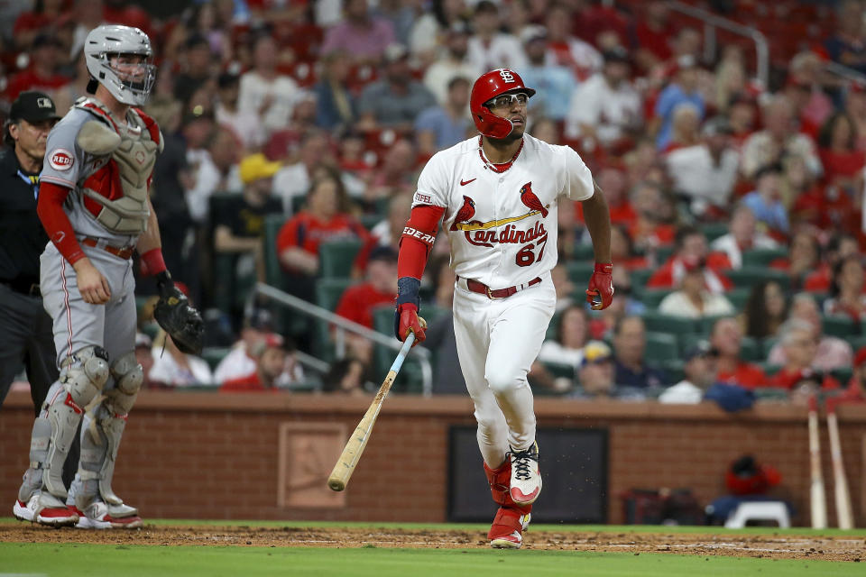 St. Louis Cardinals' Richie Palacios, right, watches his two-run home run during the third inning of a baseball game against the Cincinnati Reds, Friday, Sept. 29, 2023, in St. Louis. (AP Photo/Scott Kane)