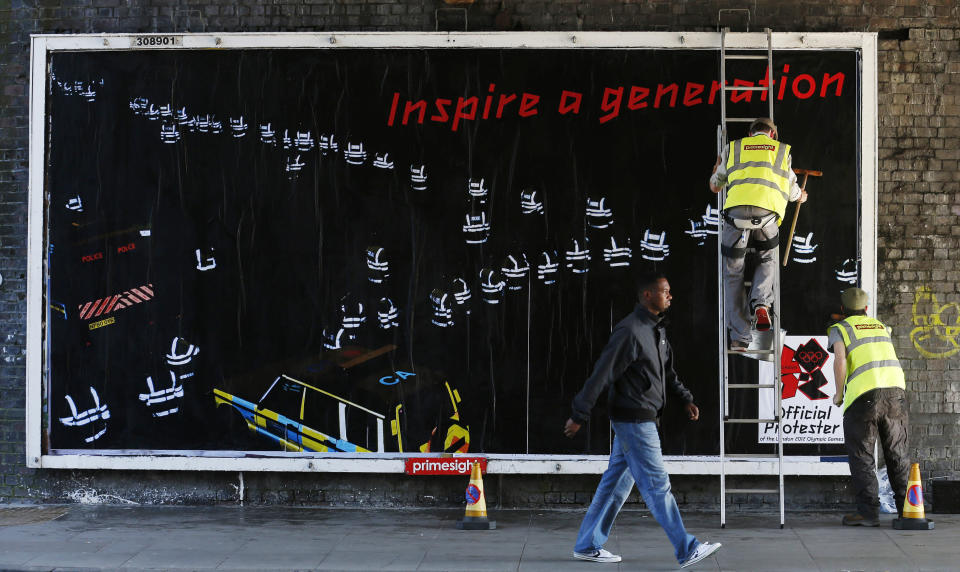 Guerrilla artists put up a billboard protesting the London 2012 Olympics in east London