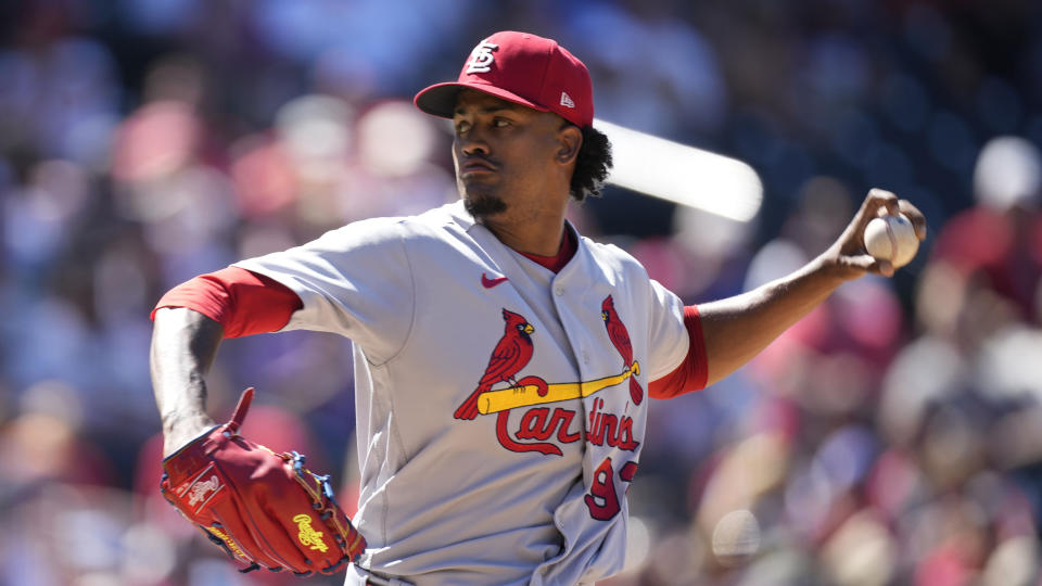 FILE - St. Louis Cardinals relief pitcher Genesis Cabrera throws in the seventh inning of a baseball game against the Colorado Rockies, Thursday, Aug. 11, 2022, in Denver. Outfielder Teoscar Hernández went to arbitration with the Seattle Mariners and will set a record win or lose, and St. Louis Cardinals pitcher Génesis Cabrera also appeared before a panel on the final day of hearings this year. (AP Photo/David Zalubowski, File)