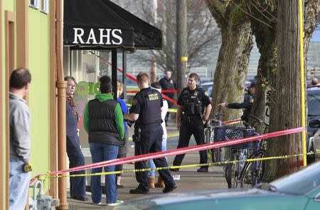 Police investigate outside the Rosemary Anderson High School in Portland, Oregon December 12, 2014. REUTERS/Steve Dipaola