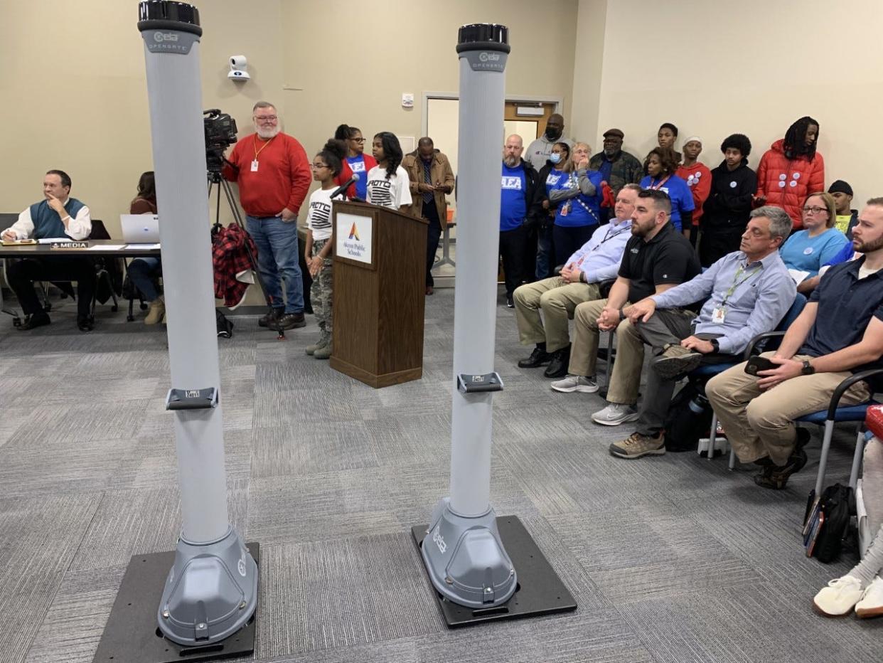 An example of the metal detectors that Akron Public Schools' administration wants to install in all middle and high schools is displayed at Monday night's school board meeting.