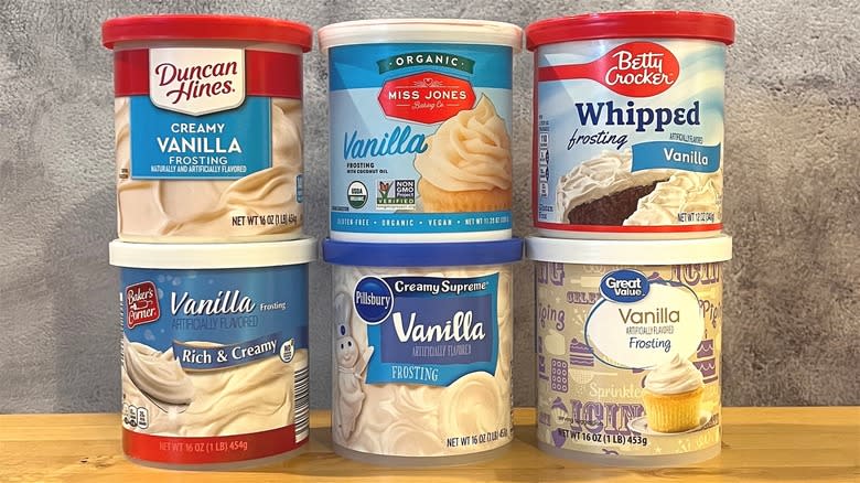 Containers of vanilla frosting