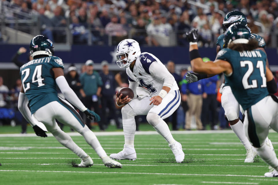 ARLINGTON, TEXAS – DECEMBER 10: <a class="link " href="https://sports.yahoo.com/nfl/players/29369" data-i13n="sec:content-canvas;subsec:anchor_text;elm:context_link" data-ylk="slk:Dak Prescott;sec:content-canvas;subsec:anchor_text;elm:context_link;itc:0">Dak Prescott</a> #4 of the Dallas Cowboys rushes during the second half against the Philadelphia Eagles at AT&T Stadium on December 10, 2023 in Arlington, Texas. (Photo by Richard Rodriguez/Getty Images)