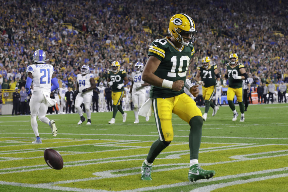 Green Bay Packers quarterback Jordan Love (10) celebrates after scoring on a 9-yard touchdown run during the second half of an NFL football game against the Detroit Lions, Thursday, Sept. 28, 2023, in Green Bay, Wis. (AP Photo/Mike Roemer)