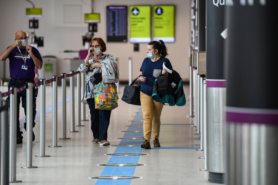 Passengers arrive at UK airports as quarantinue rules are lifted (Getty Images)