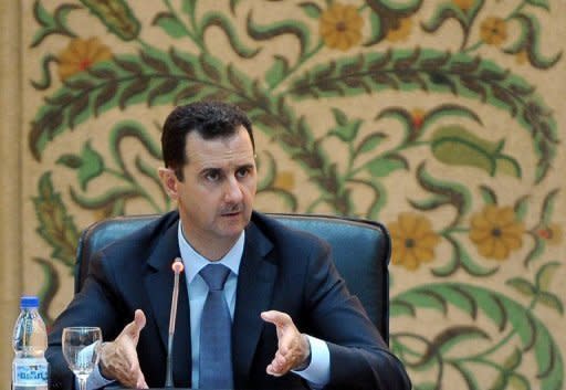 Syrian President Bashar al-Assad addresses his new cabinet during a swear-in ceremony in Damascus on June 23. Twin bombs exploded outside the Palace of Justice in Damascus on Thursday as deadly violence raged across the country and Turkey reinforced its volatile border with Syria with missile batteries