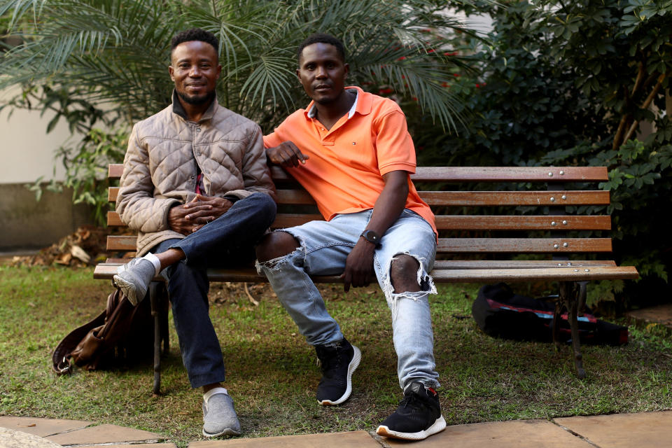 Nigerian refugees Thankgod Matthew and Roman Ebimene pose for a photo during an interview, after being rescued from a ship rudder on the Brazilian coast, in Sao Paulo, Brazil July 26, 2023. REUTERS/Carla Carniel