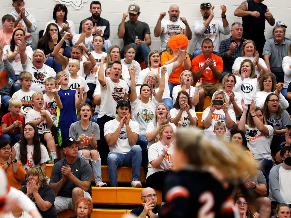 Fans cheer after a winning point during New Lexington's 20-25, 21-25, 25-15, 22-25 loss to Union Local in a Division II regional final on Saturday at Heath High School. The Panthers ended a 22-6 season that included its first regional runner-up in school history and its first district title since 1983.