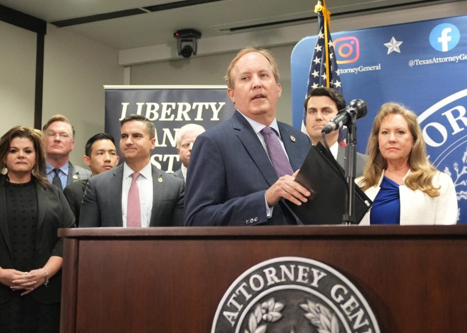 Attorney General Ken Paxton speaks at a news conference at the Price Daniel State Office Building on May 26.