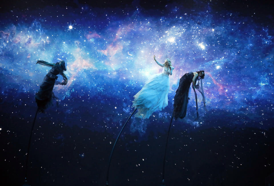 Kate Miller-Heidke of Australia, center, performs the song "Zero Gravity" during the 2019 Eurovision Song Contest grand final in Tel Aviv, Israel, Saturday, May 18, 2019. (AP Photo/Sebastian Scheiner)