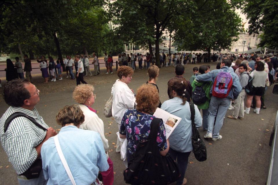 Tourists wait to buy tickets for the summer opening of Buckingham Palace in 1995.
