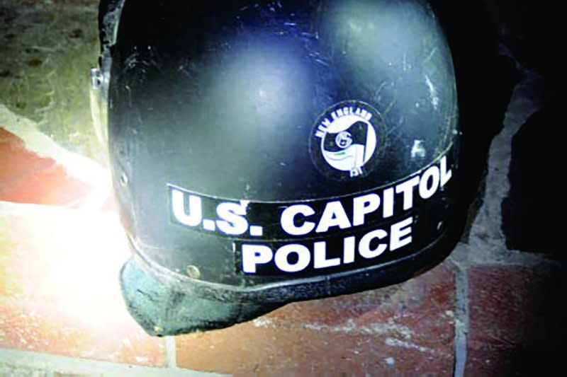 Richard Zachary Ackerman, 22, admitted to stealing a U.S. Capitol Police Riot helmet during the Jan. 6, 2021, attack on Congress. Affixed to the stolen property is a sticker of the New England 131 neo-Nazi group. Photo courtesy of U.S. Justice Department