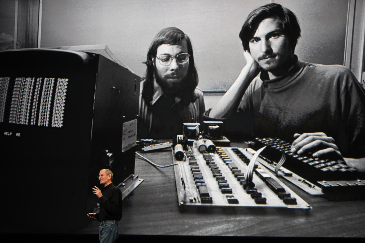 Steve Jobs, Apple Inc. CEO, speaks under a photo of hime and co-founder Steve Wozniak (L) at a conference in San Francisco, California. (Photo by Kimberly White/Corbis via Getty Images)