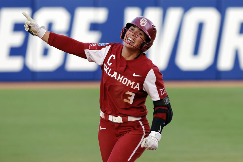 Oklahoma's Grace Lyons celebrates a home run against Florida State during the fifth inning of the second game of the NCAA Women's College World Series softball championship series Thursday, June 8, 2023, in Oklahoma City. (AP Photo/Nate Billings)