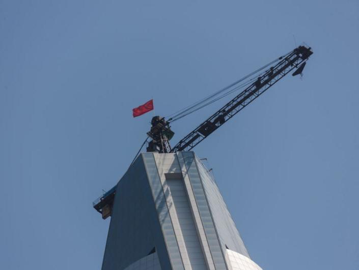 A crane on the roof of the Ryugyong Hotel.