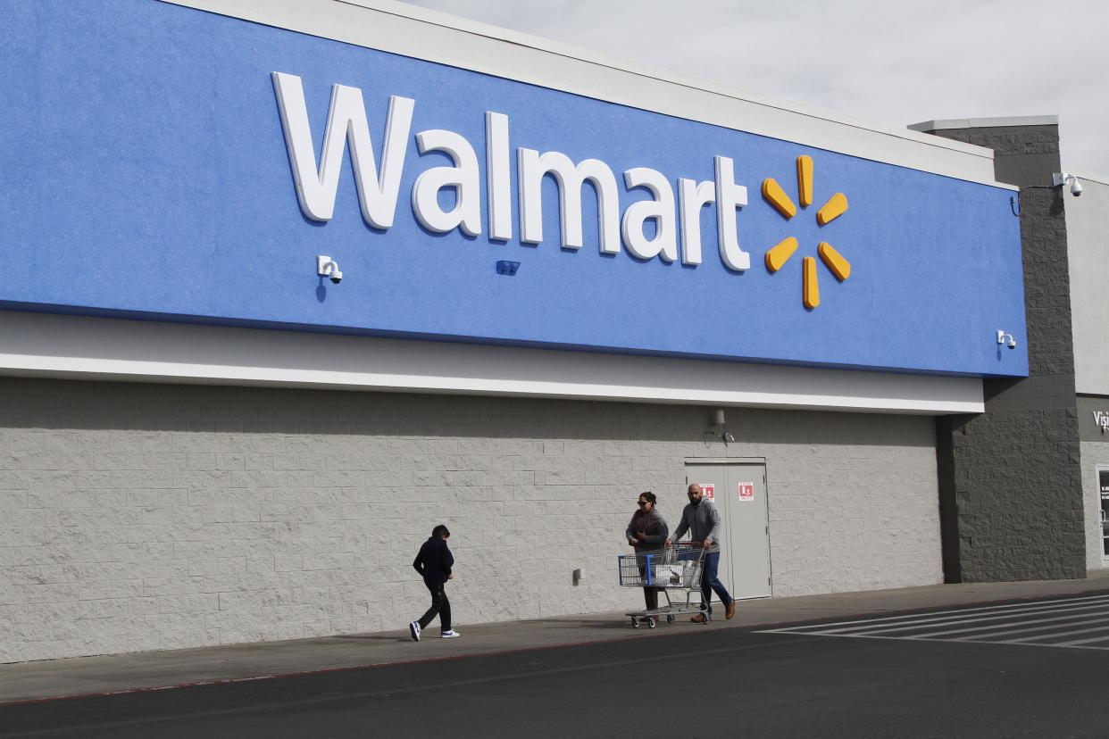 People shop at a Walmart Thursday, Feb. 6, 2020, in El Paso, Texas. The Justice Department is suing Walmart, alleging the company unlawfully dispensed controlled substances through its pharmacies, helping to fuel the opioid crisis in America, a person familiar with the matter told The Associated Press. The civil complaint being filed Tuesday, Dec. 22, 2020 points to the role Walmart’s pharmacies may have played in the crisis by filling opioid prescriptions and by unlawfully distributing controlled substances to the pharmacies during the height of the opioid crisis, the person said. (AP Photo/Cedar Attanasio)