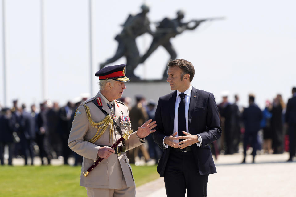 French President Emmanuel Macron and Britain's King Charles III attend the UK's national commemorative event for the 80th anniversary of D-Day in Ver-sur-Mer, France, Thursday, June 6, 2024. (AP Photo/Alastair Grant)