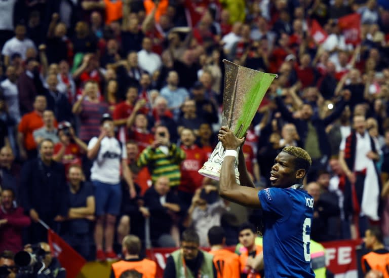 Manchester United's midfielder Paul Pogba celebrates with the trophy after the UEFA Europa League final football match Ajax Amsterdam v Manchester United on May 24, 2017 at the Friends Arena in Solna outside Stockholm