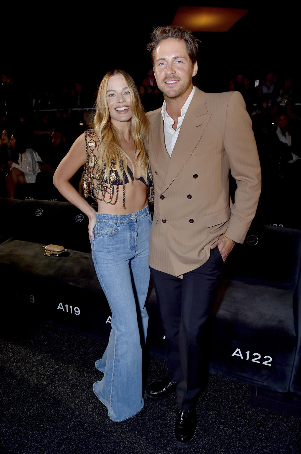 Margot Robbie, left, and Tom Ackerley attend the Chanel Cruise 2023/2024 Fashion Show on Tuesday, May 9, 2023, at Paramount Studios in Los Angeles. (Photo by Jordan Strauss/Invision/AP)