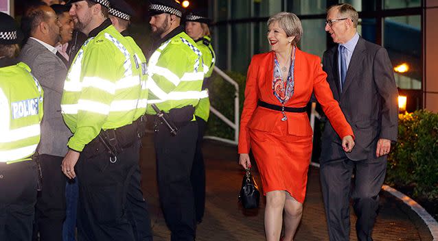 Britain's Prime Minister Theresa May arrives with her husband Philip for the declaration in the general election at her constituency in Maidenhead, England. Picture: AAP