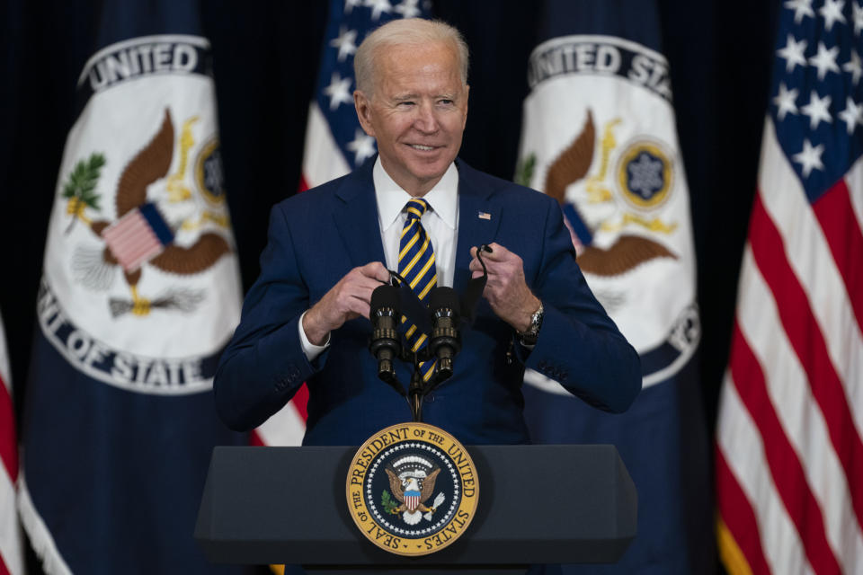 President Joe Biden smiles as he arrives to deliver remarks to State Department staff, Thursday, Feb. 4, 2021, in Washington. (AP Photo/Evan Vucci)