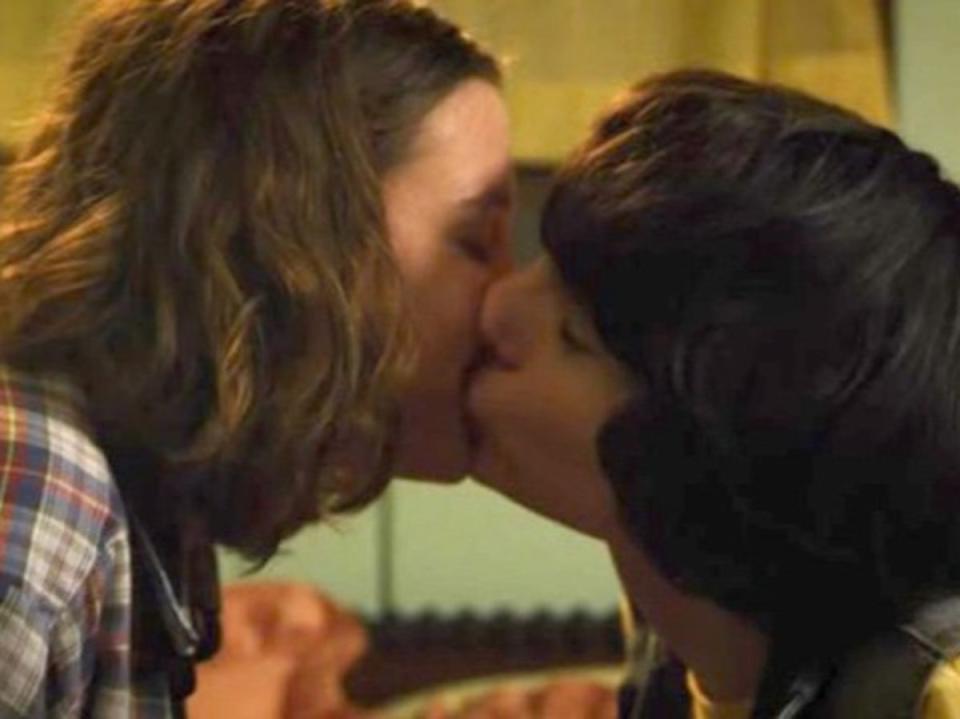 Eleven (Millie Bobby Brown) and Mike (Finn Wolfhard) kiss in ‘Stranger Things’ (Netflix)