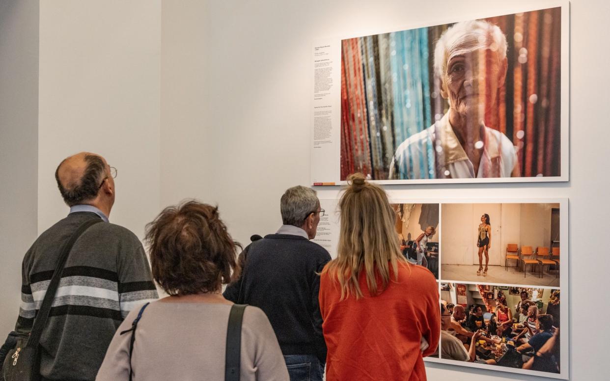 Visitors view the award-winning work 'Home for the Golden Gays'