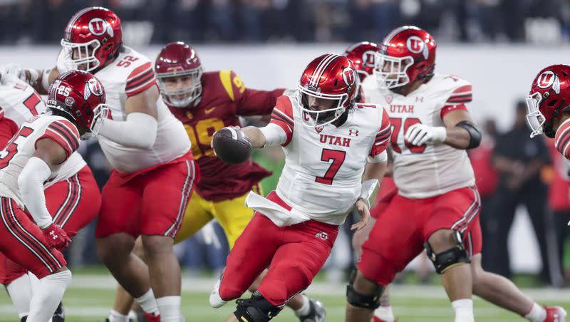 Utah Utes QB Cameron Rising goes for a handoff while playing the USC Trojans in the Pac-12 championship at the Allegiant Stadium in Las Vegas on Friday, Dec. 2, 2022. The Utes are two-time Pac-12 champions and among five conference teams in the top 25 of the post-spring ESPN SP+ rankings.