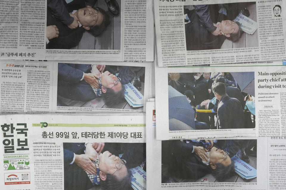 Newspapers' front pages are seen reporting South Korean opposition leader Lee Jae-myung, in Seoul, South Korea, Wednesday, Jan. 3, 2024. South Korea police on Wednesday raided the residence and office of a man who stabbed the country’s opposition leader, Lee Jae-myung, in the neck earlier this week in an attack that left him hospitalized in an intensive care unit, officials said.(AP Photo/Lee Jin-man)